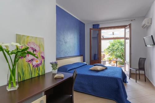 Ένα ή περισσότερα κρεβάτια σε δωμάτιο στο Bed&Breakfast Acasamia