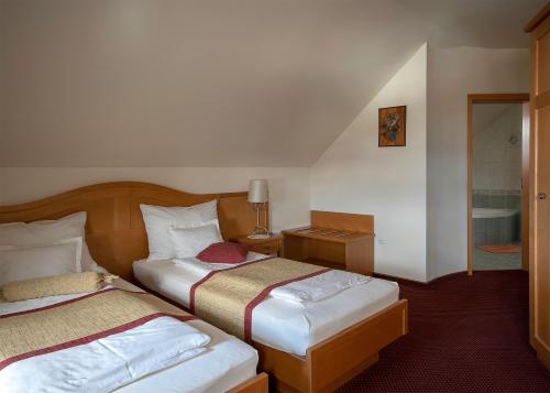 מיטה או מיטות בחדר ב-Guesthouse Tulipan