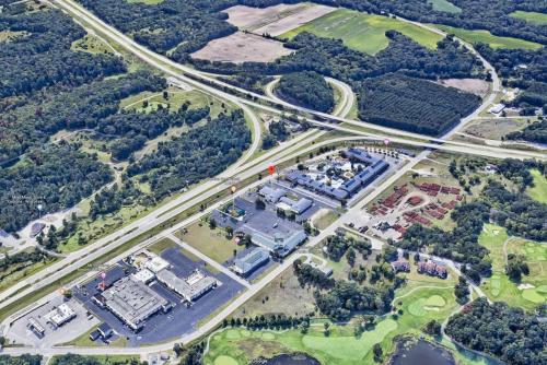 an aerial view of a city with a highway at Econo Lodge Inn & Suites Wisconsin Dells in Wisconsin Dells