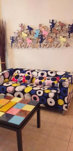 a couch with panda bears on it in a living room at Magic Mola in Mola Kalyva