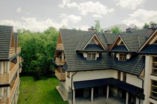 an overhead view of a house with a roof at Aparthotel Bellamonte in Zakopane