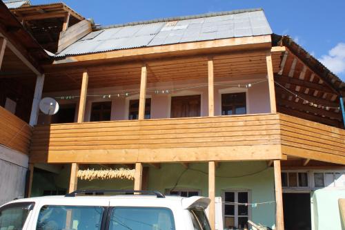 a house with solar panels on top of it at Ecohouse Svaneti in Mestia