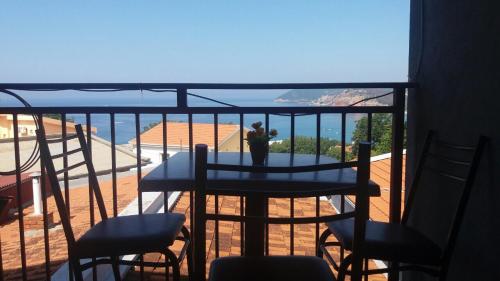 a view of a balcony with a table and chairs at Guesthouse Stankovic in Sutomore