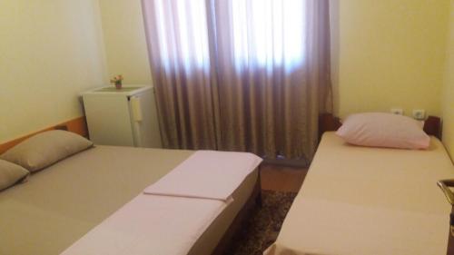 Een bed of bedden in een kamer bij Guesthouse Stankovic