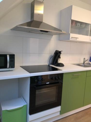 Dapur atau dapur kecil di Fewo und Meer WHV