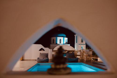 a view of a mosque from a window of a building at Aeris suites in Koufonisia