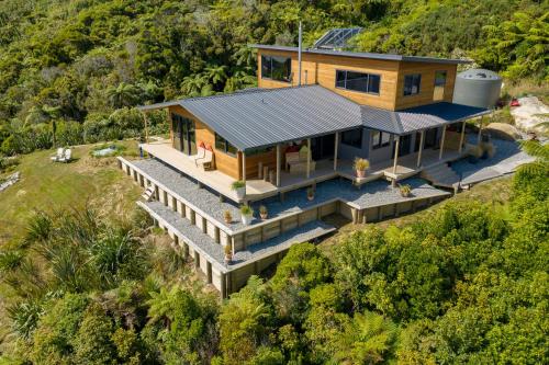 an aerial view of a house with a solarium at Tasman Sea Retreat in Punakaiki
