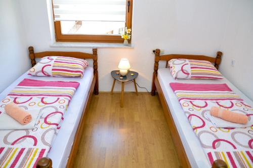 Una cama o camas en una habitación de Apartman Lana
