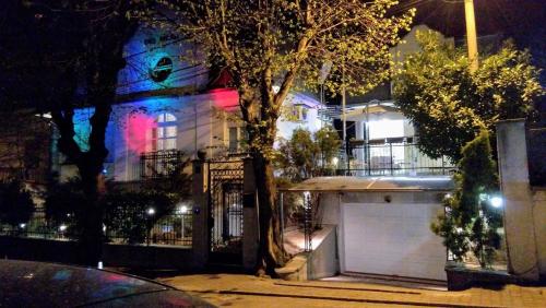 a house with a garage in front of it at night at Resident hill resort in Belgrade