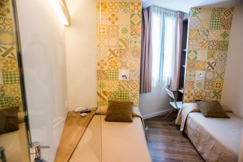 Postel nebo postele na pokoji v ubytování Hostal Marenostrum