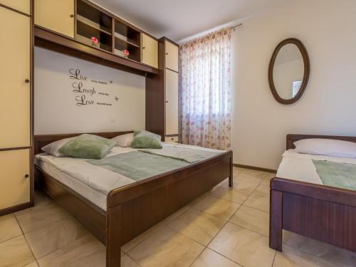 Posteľ alebo postele v izbe v ubytovaní Apartment Slavka