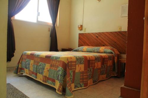 Postel nebo postele na pokoji v ubytování Hotel Avenida