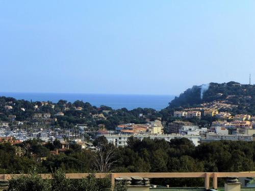 a view of the city and the ocean at Apartment Les Mimosas-1 by Interhome in Cavalaire-sur-Mer