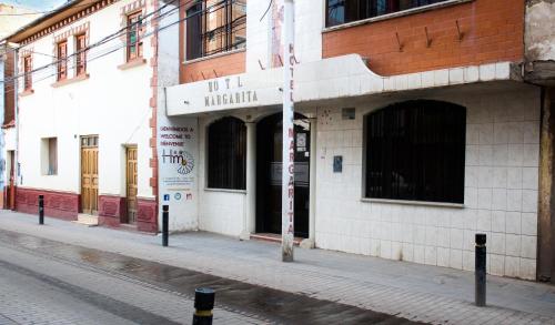 a building on the side of a street at Hotel Margarita in Puno