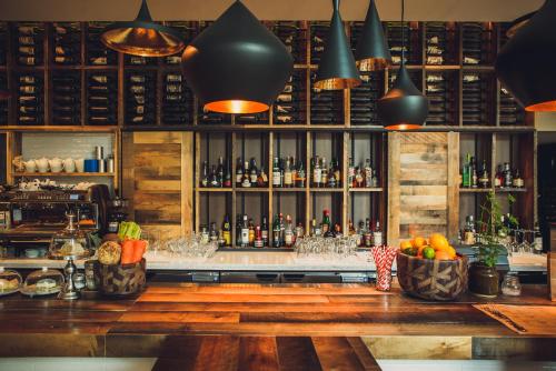 a bar with a lot of bottles of alcohol at DoubleTree by Hilton Ottawa Downtown in Ottawa