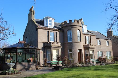 a large house with a gazebo in front of it at The Limes Guest House in Montrose