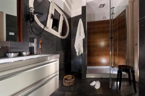 a bathroom with a sink and a shower at Bouganville Hill Resort & Wellness Space in Picerno