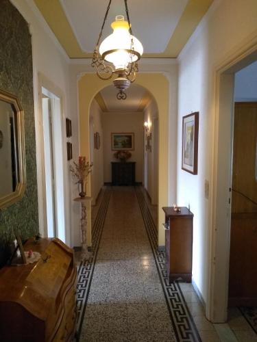 a hallway in a building with a chandelier at La casa dei Fiori in Vetralla