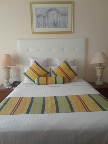 Ένα ή περισσότερα κρεβάτια σε δωμάτιο στο Beach Luxury Hotel