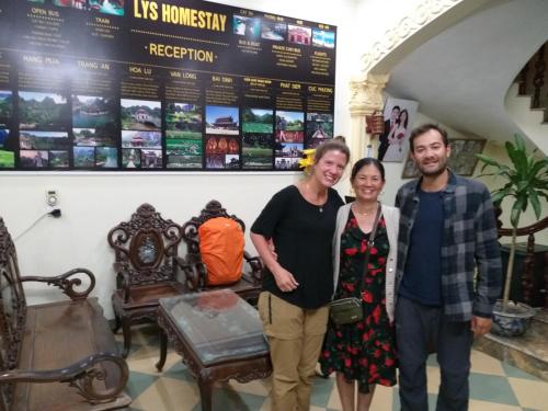 a group of people standing in a room with a sign at Lys Homestay in Ninh Binh