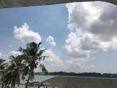 a view of a body of water with palm trees at Tudor Water Sports Hotel in Mombasa