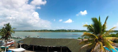 a view of a body of water with boats at Tudor Water Sports Hotel in Mombasa