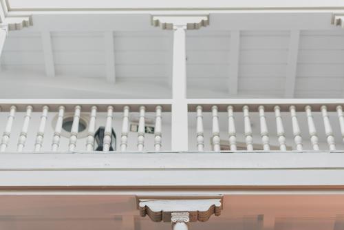 a white balcony with a white fence at Palacio De Los Navas in Granada