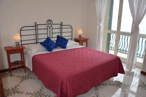 เตียงในห้องที่ Le Cicale - Apartments