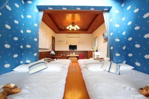 Yilan Pine Villa Homestayにあるベッド