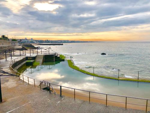a view of a body of water with a fence at Quinta da Villa in Cascais