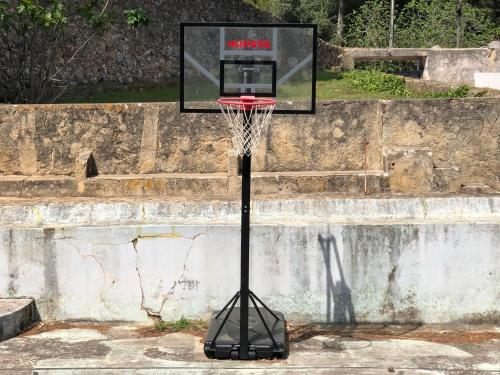 a basketball hoop with a net on a wall at Quinta da Villa in Cascais