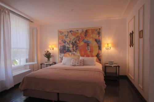 Ένα ή περισσότερα κρεβάτια σε δωμάτιο στο Moshinos Hotel