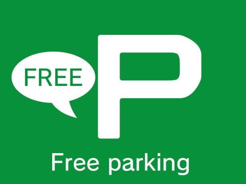 a sign with a speech bubble and free parking at Hotel AQUA Blue Yokosuka (Adult Only) in Yokosuka