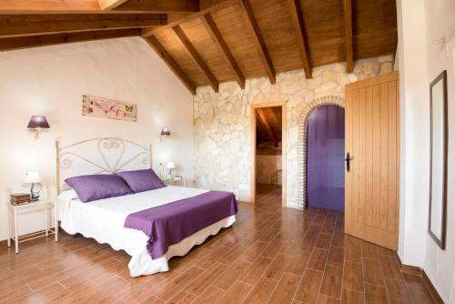 מיטה או מיטות בחדר ב-Villa fuente redonda