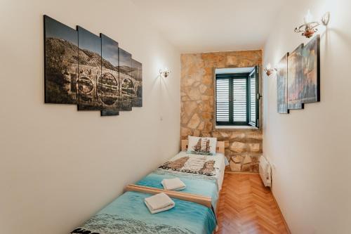 a room with two twin beds in a room at Stone House Herceg Novi in Herceg-Novi