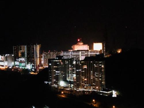 a view of a city at night with lights at Sky D'Mont Suites in Genting Highlands