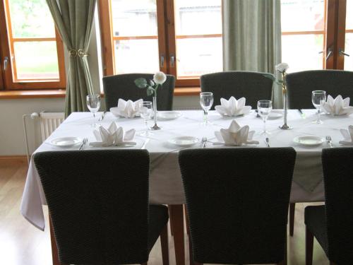 a white table with flowers on top of it at Tähetorni Hotel in Tallinn