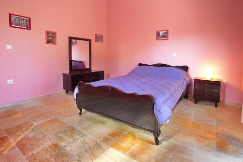 Ένα ή περισσότερα κρεβάτια σε δωμάτιο στο Darmani Spyros Apartments