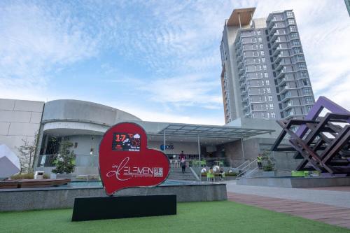 a heart statue in front of a building at Sky D'Mont Suites in Genting Highlands