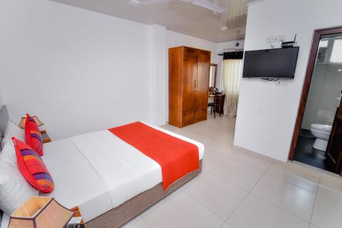 Postel nebo postele na pokoji v ubytování My City Hotel