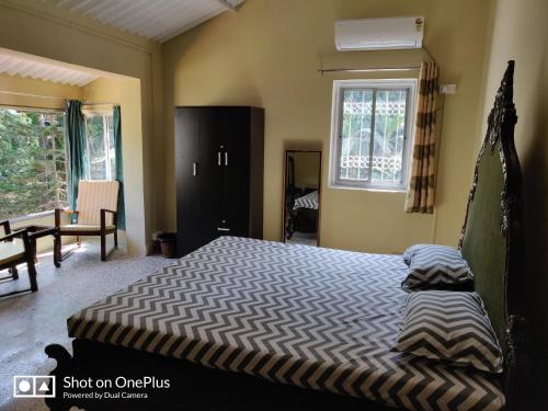 Ένα ή περισσότερα κρεβάτια σε δωμάτιο στο Leela's Cottage