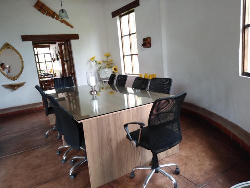a conference room with a long table and chairs at Casa Hacienda Nasca Oasis in Nazca