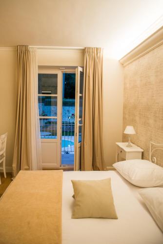 a bedroom with a large bed and a window at Maralè in Serino