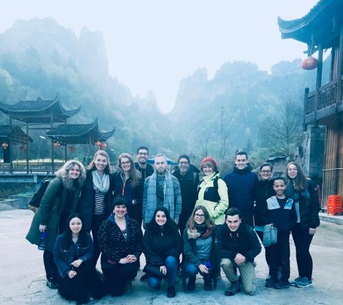 a group of people posing for a picture at Tongfu Inn(In the National Park) in Zhangjiajie