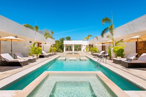 an image of a swimming pool in a house at Avela Boutique Hotel in Sayulita