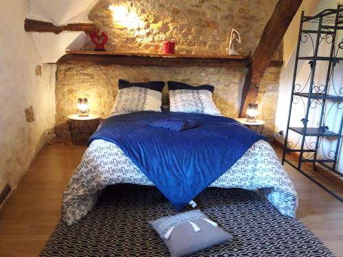 Llit o llits en una habitació de Ambeyrac gîte Cap Del Mas