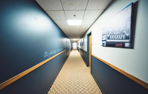 a hallway in a hospital with a poster on the wall at HI Chicago Hostel in Chicago