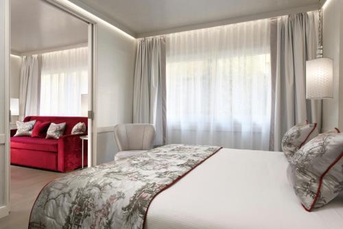 Postel nebo postele na pokoji v ubytování Ponte Vecchio Suites & Spa