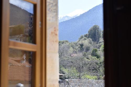 a window with a view of a mountain at Great Mantineia in Levidhion