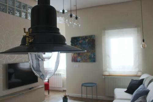 Televízia a/alebo spoločenská miestnosť v ubytovaní Apartamento Mercado-Centro